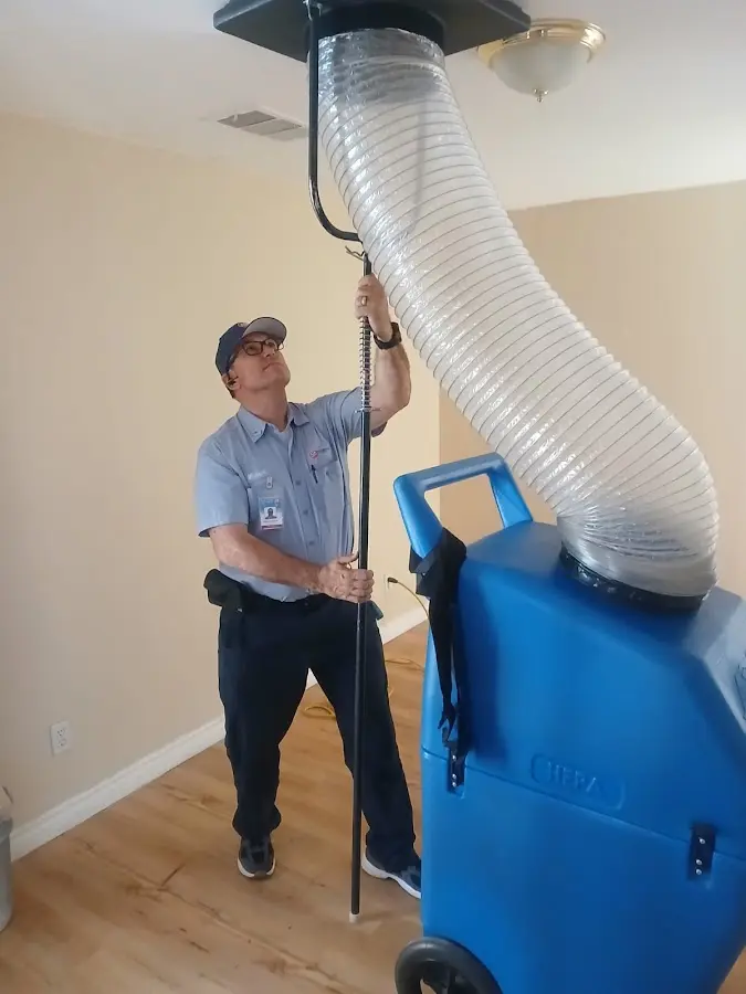 Furnace Tune-Up technician using HEPA equipment in Sylvania